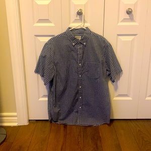 Checkered shirt sleeve button. Good condition